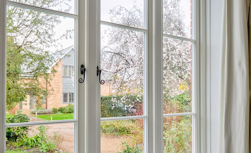 Traditional casement window with monkey tail handles